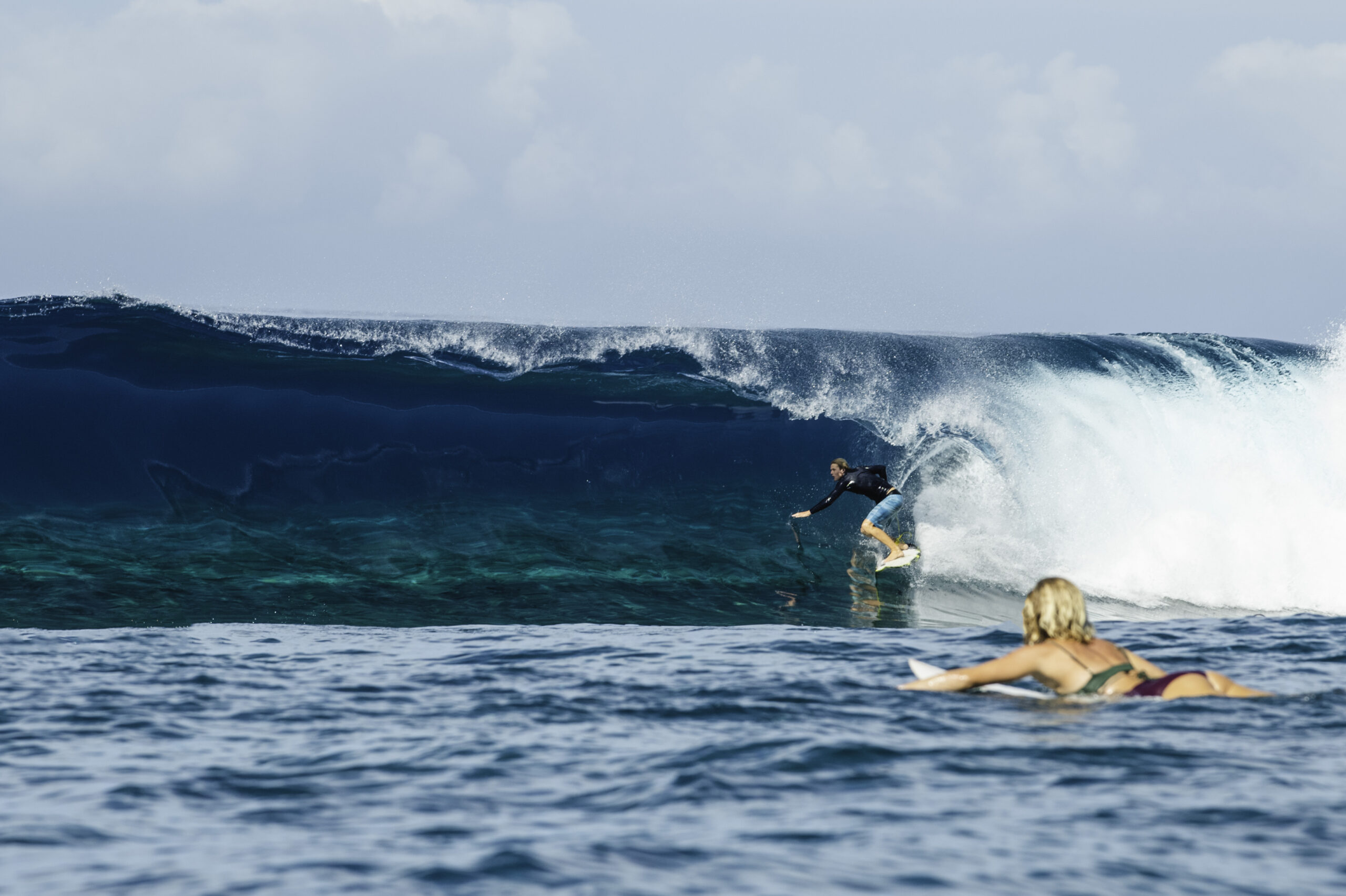 Surfer riding a barrel wave in Fiji